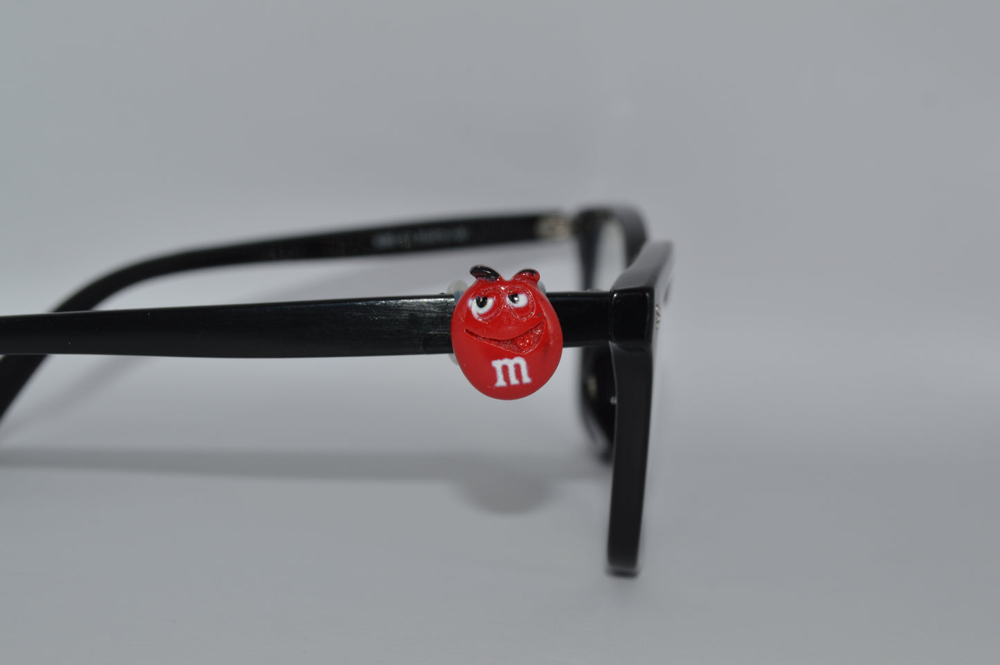 M&M Eyedeco Charm                                                   K30